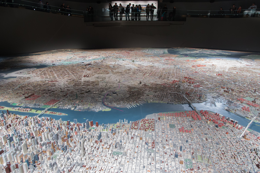 The Panorama is the largest model of New York City made in 1964 featuring 895,000 miniature buildings,the five boroughs, all NYC roads and bridges. A scattering of lights shine on the model representing different buildings, an airplane lands and departs from LaGuardia Airport, and the room lighting changes on a 16 minute day to night cycle for a full day in the city. With the last major update in 1994 and a few additions since then, the new Citi field is on view as well as the once standing Twin Towers.