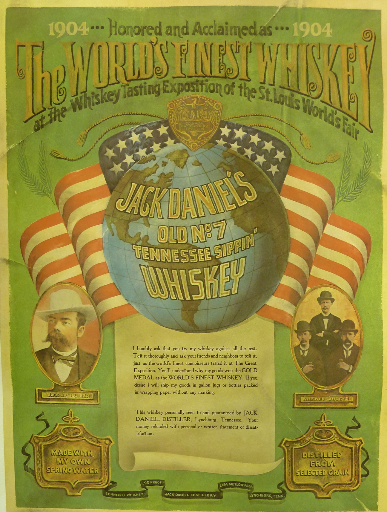 A green exposition poster with a centered blue and green globe, hovering over an American flag ribbon with a gold emblem. The globe has the words “Jack Daniel’s Old Number Seven Tennessee Sippin’ Whiskey” wrapped over it. At the top reads “The World’s Finest Whiskey at the Whisky Tasting Exposition of the St. Louis World’s Fair”.