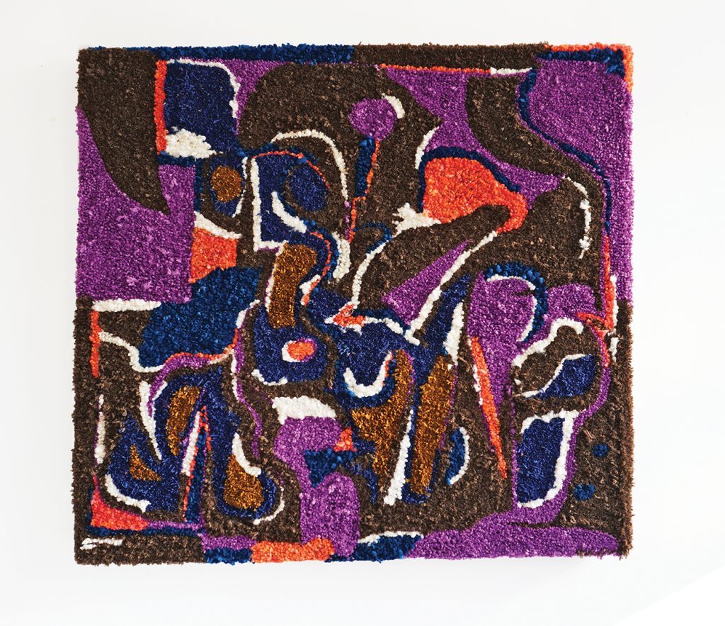 A square textured abstract painting made of brown, purple, gold, orange and white yarns, some of which are puffy shapes.
